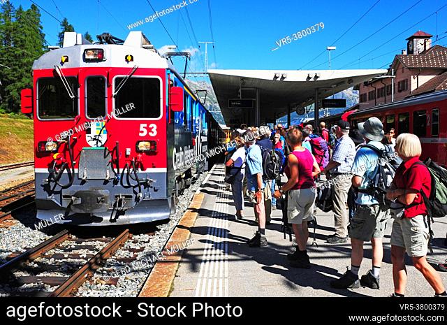 Tourist attraction: Hikers at the train station in Pontresina in the upper Engadin in the Swiss alps