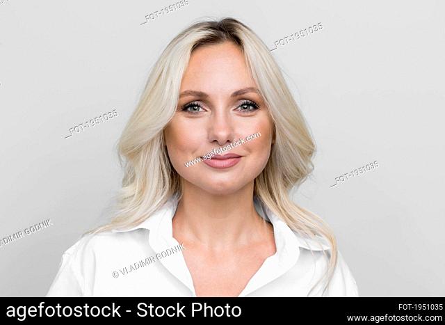 Portrait confident beautiful blonde woman