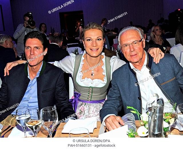 Soccer legend Franz Beckenbauer (R), former ski racer Maria Hoefl-Riesch and her husband Marcus Hoefl are pictured during the gala on occasion of 'Camp...