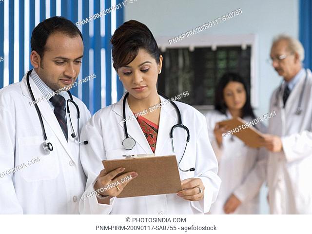 Doctors examining reports, Gurgaon, Haryana, India