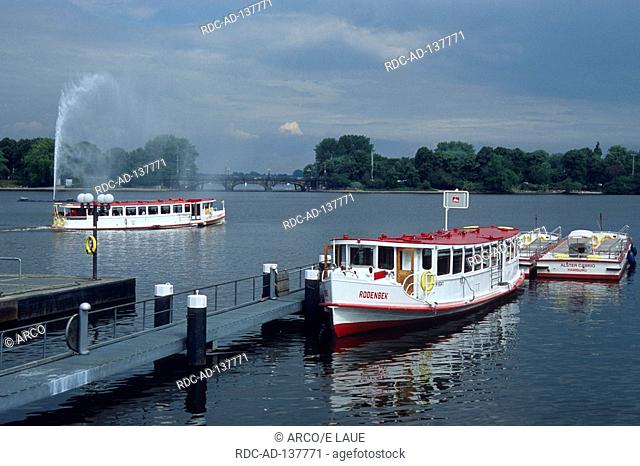 Alster with pleasure steamers near Lombard bridge Hamburg Germany