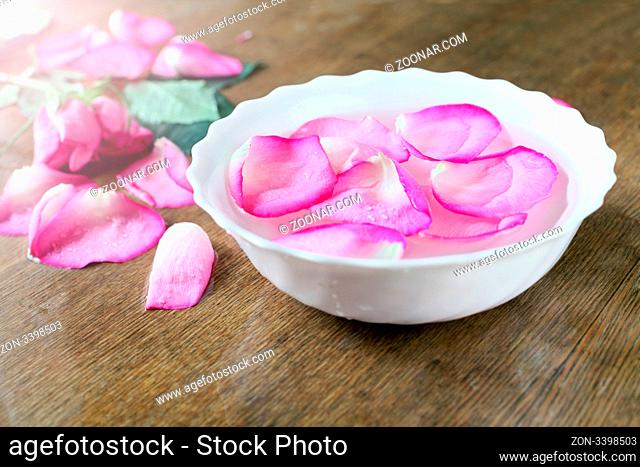 bowl with water and rose petals