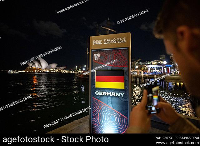29 July 2023, Australia, Sydney: A sign from the Fox television station for the 2023 Women's World Cup in Australia and New Zealand shows the German flag and...