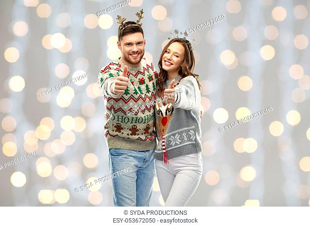 happy couple at christmas ugly sweater party