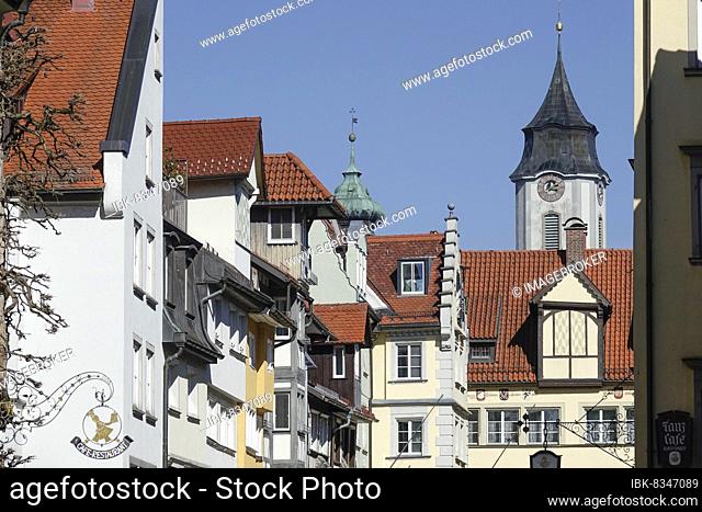 Old houses on the pedestrian zone Maximilianstraße, in the back towers of the Minster and St. Stephen's Church, Lindau am Lake Constance, Swabia, Bavaria
