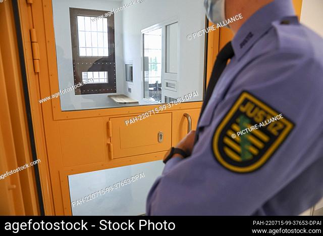 15 July 2022, Saxony, Leipzig: A judicial officer stands in front of the preventive and security room (PSR) for suicidal inmates in the new detention hospital...