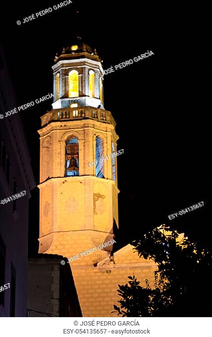 Night view of the illuminated of Santa Maria baroque church in Cubelles, Barcelona, Catalonia, Spain