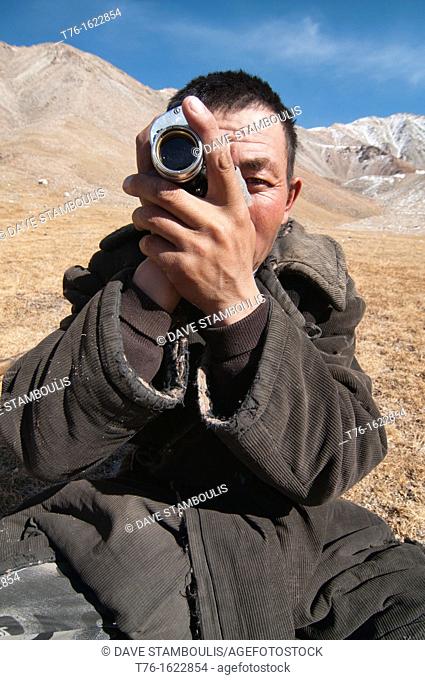 Kazakh eagle hunter and his monocular in the Altai Region of Bayan-Ölgii in Western Mongolia