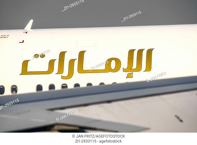 airplane of the Emirates with arabic