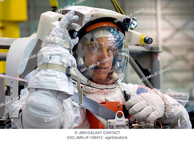 Astronaut Clayton C. Anderson, Expedition 15 NASA space station science officer and flight engineer, puts the final touches on the suit-up process with a...