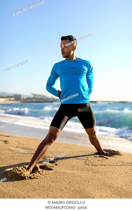 Man doing workout on the beach
