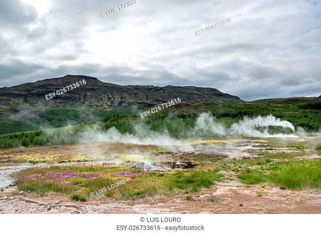 Geysir smoking, touristic atraction in Iceland, June