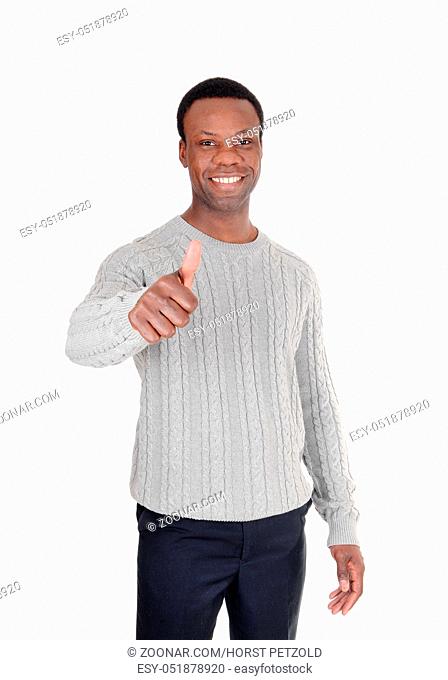 A young African American man in a gray sweater with one hand sign thumps up and smiling, isolated for white background