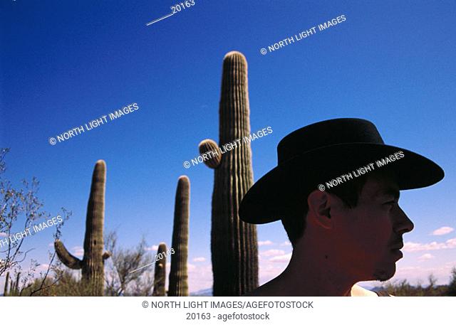 Cowboy and Saguaro cactus. Arizona. USA