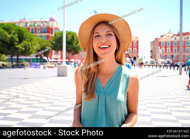 Portrait of smiling relaxed traveler woman walking in the city of Nice, Cote d'Azur, France
