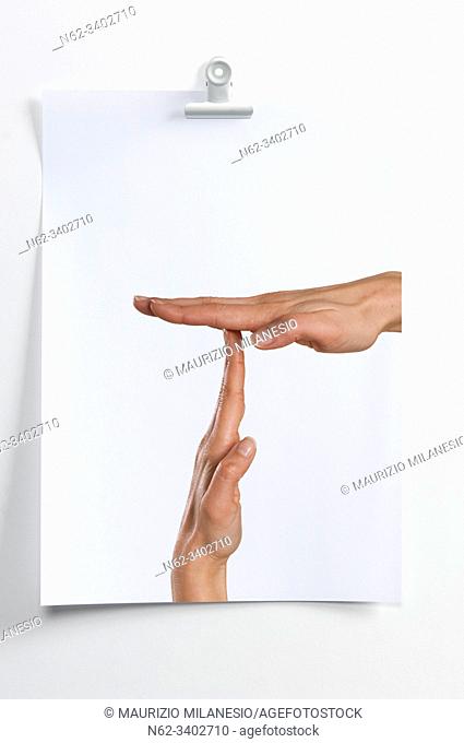 Blank sheet hanging on the wall with image of hands indicating break time