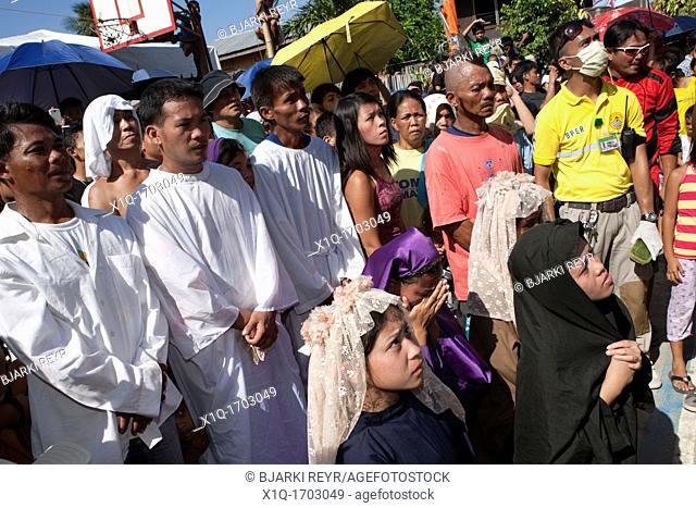 Cebu City, Philippines, Good-Friday, 6 April 2012: Gilbert Bargayo, being nailed to the cross for the 17th Good Friday, with six-inch nails