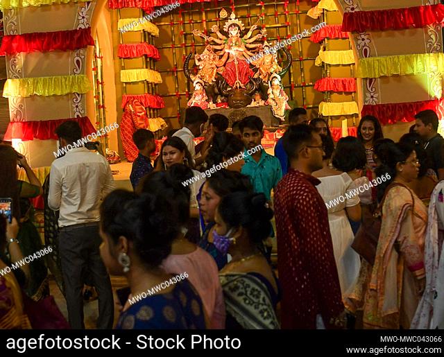 Agartala, Tripura, India. 13-10-2021. People visit a makeshift place of worship on the occasion of Durga Puja festival in Agartala