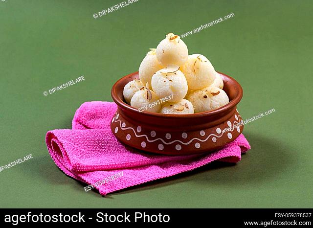 Indian Sweet - Rasgulla, Famous Bengali sweet in clay bowl with napkin