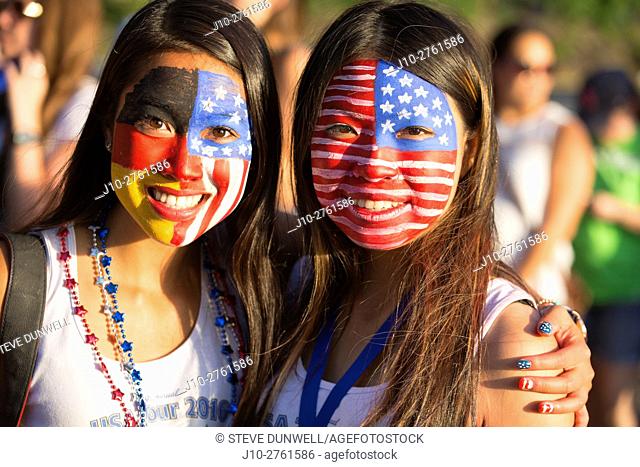 Two young women with face paint flags, July 4, Esplanade, Boston, Massachusetts, USA