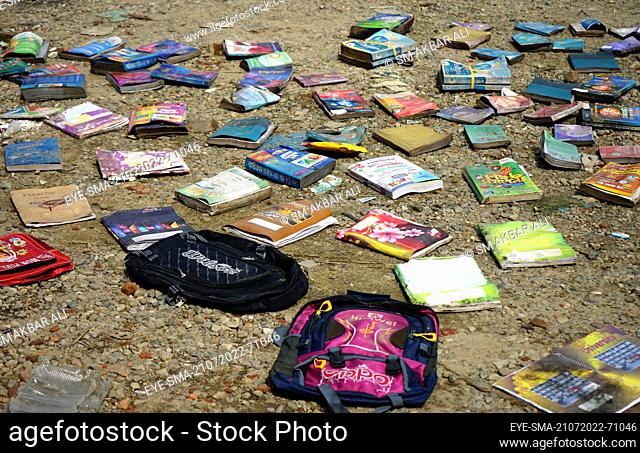 July 21, 2022. Sylhet Bangladesh: Books, notebooks and school bags are being dried on the roadside. Several bookstore in sylhet were flooded due to heavy rain