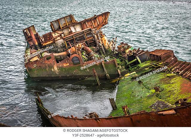 A boat run aground and stripped of all recoverable fixtures and fittings. Gaansbaai Goose Bay, Western Cape Province, South Africa.