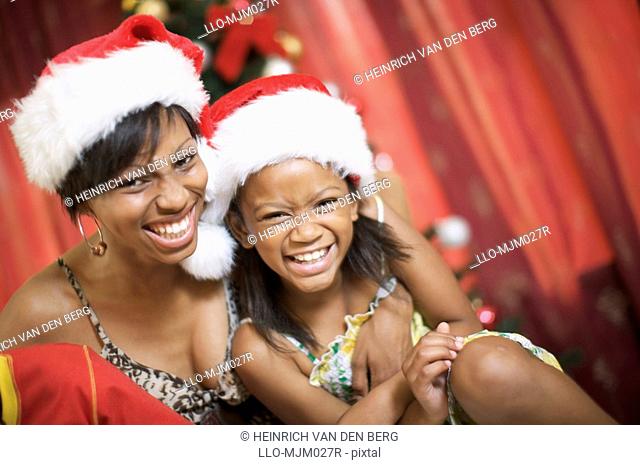 Mother and daughter laughing at Christmas, Pietermaritzburg, KwaZulu-Natal Province, South Africa