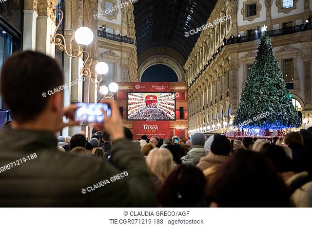 People gather inside the Vittorio Emanuele II gallery to watch the premier of La Scala Theatre on a screen, Milan , ITALY-07-12-2019