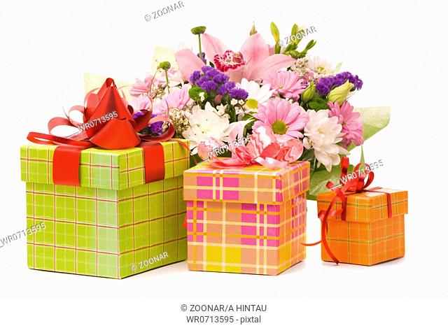 Magnificent bouquet and present boxes on a white