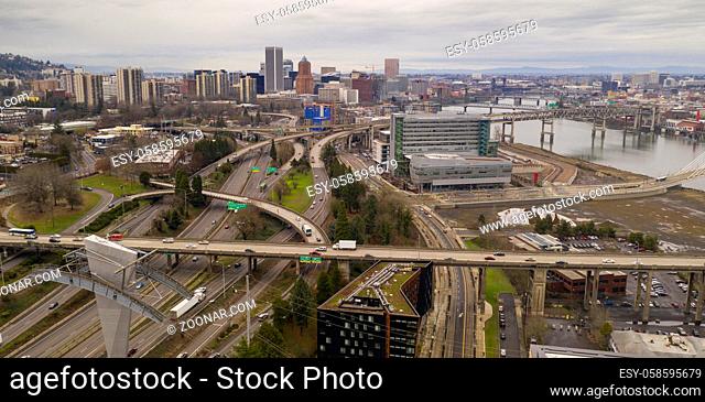 jumble of roads heads into and around Portland the Willamette River flowing underneath