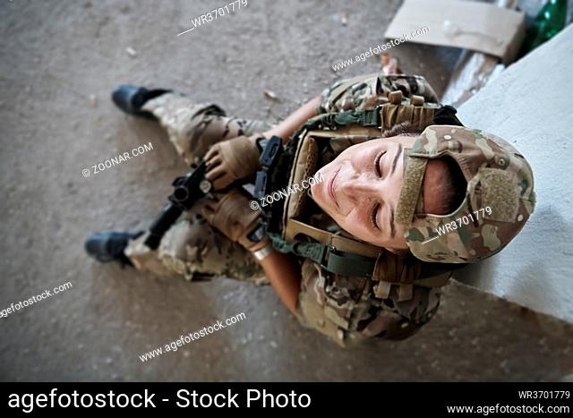 military army female soldier lady killer having a break in urban  modern warfare enviroment