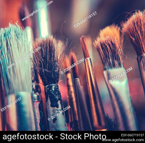 Retro Style Image Of Old Artist's Paint Brushes WIth Shallow DoF