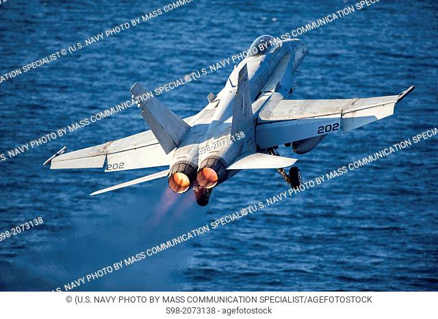 GULF OF OMAN (Nov. 25, 2013) An F/A-18C Hornet assigned to the 'Checkerboards' of Marine Fighter Attack Squadron 312 launches from the flight deck of the...