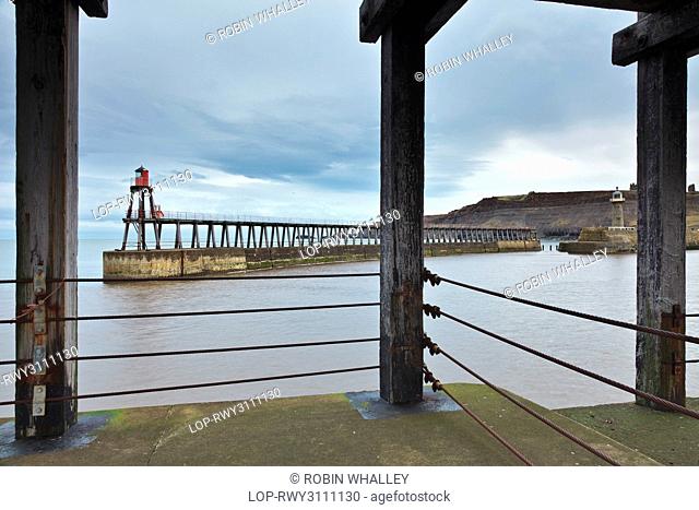 England, North Yorkshire, Whitby. The new and old lighthouses on Whitby east pier