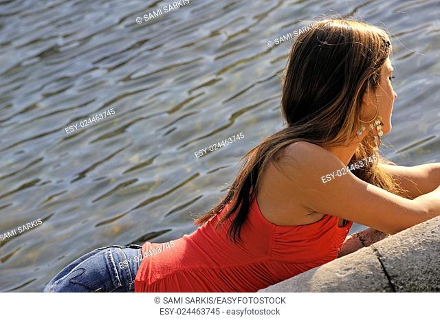 Young woman contemplating water, Marseille, France
