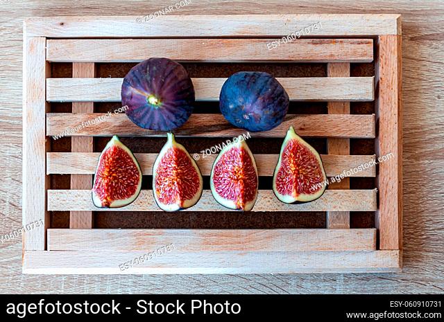 Fresh fig fruit on a wooden cutting board