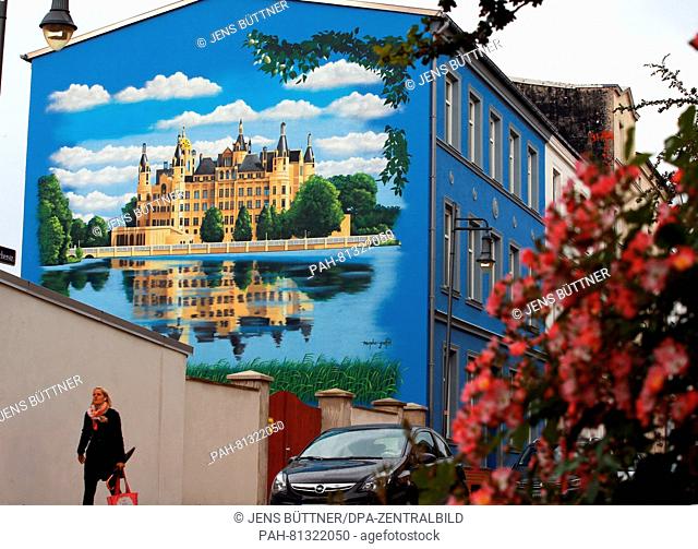 A wall painting by graffiti artist Daniel Wrede in Schwerin, Germany, 18 June 2016. More and more people order graffiti artists to design ehmpty walls and...