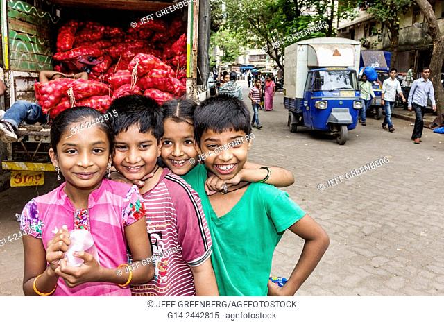 India, Asian, Mumbai, Dharavi, Shahu Nagar Road, slum, girl, boy, friends, posing