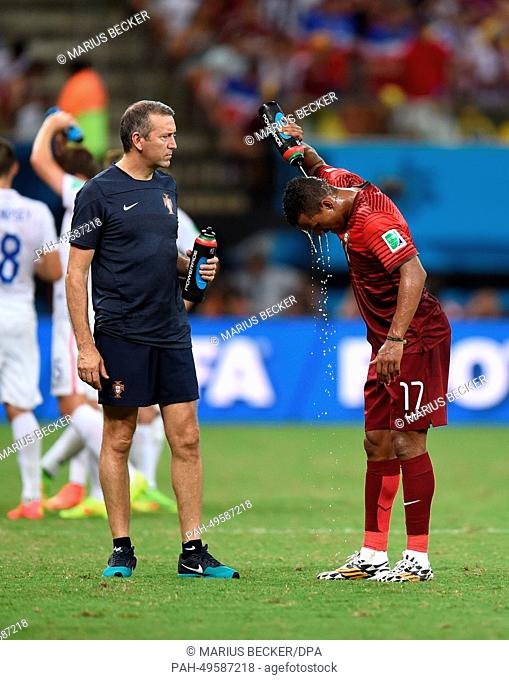 Nani (R) of Portugal refreshes with water during the FIFA World Cup 2014 group G preliminary round match between the USA and Portugal at the Arena Amazonia...