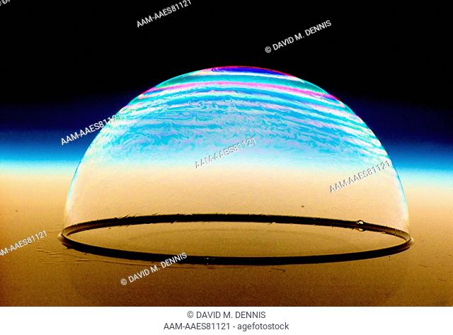 Soap bubble, the colors are the result of light defraction by the variation of thickness of the bubble film