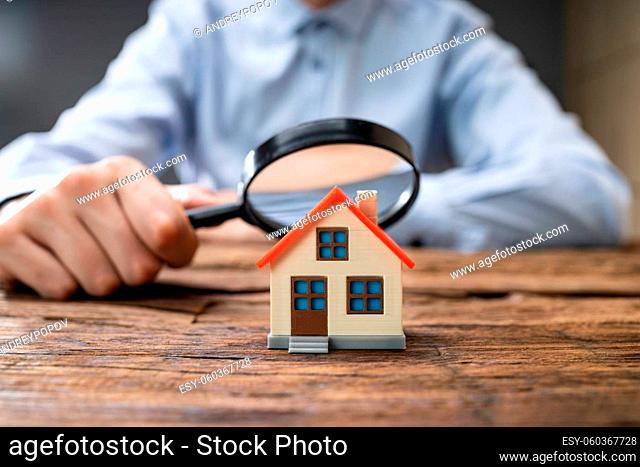 Real Estate House Inspection Before Purchase Using Magnifying Glass
