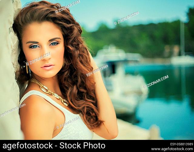 luxury potrait beautiful girl, gold jewel, curly hair