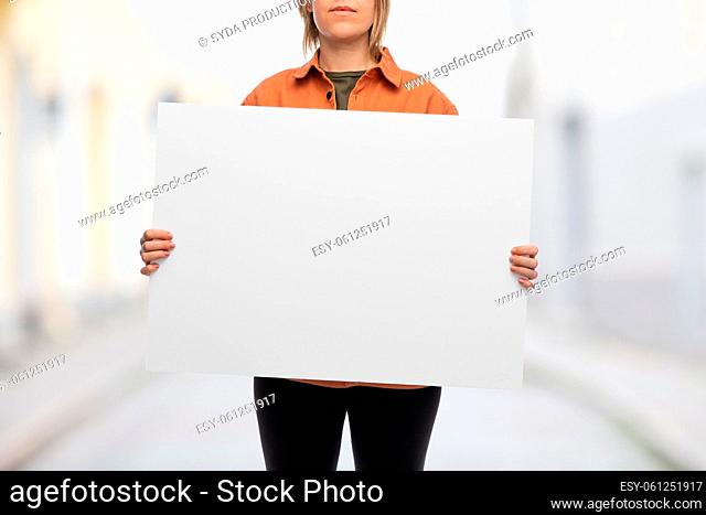 woman with poster protesting on demonstration