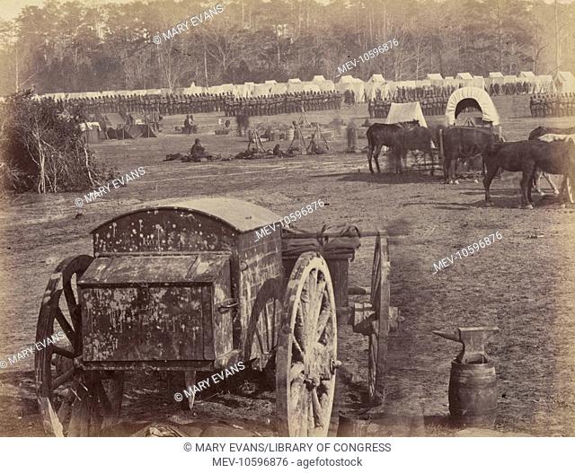 Inspection of troops at Cumberlanding, Pamunkey, Virginia. Wagon and anvil in the foreground, troops in formation in the background