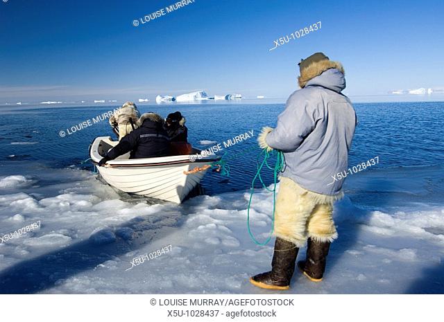 Qaanaaq, Greenland April 2006  Launching a boat into the frigid waters for a walrus hunt