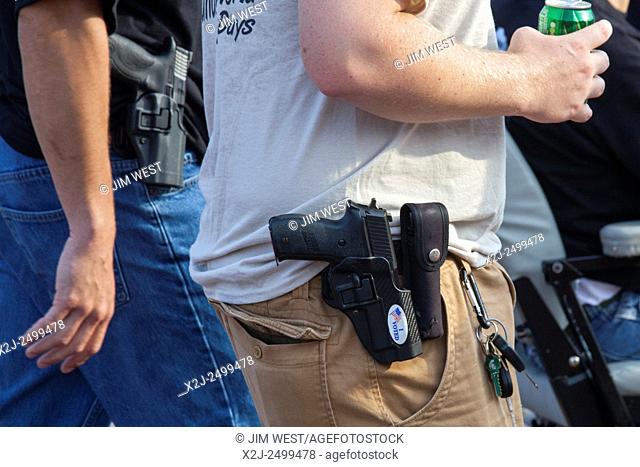 Detroit, Michigan - Members of the Ironworkers union openly carry hand guns during Detroit's Labor Day parade