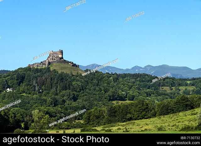 Castle of Murol and view on Sancy massif in Auvergne Volcanoes Natural Park, Puy de Dome department, Auvergne-Rhone-Alpes, France, Europe