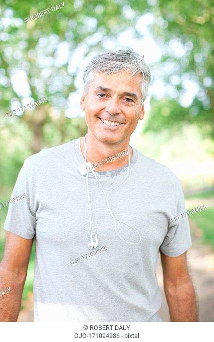 Smiling man standing outdoors