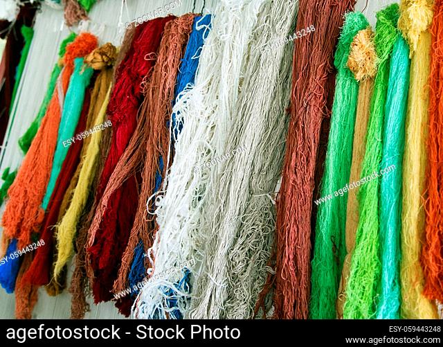 Multicolored thread for making carpets in a manufacture