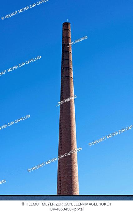 Old actory chimney made of bricks, against blue sky, Lauf an der Pegnitz, Middle Franconia, Bavaria, Germany